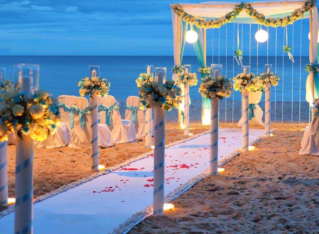 Friends wedding theme - beach wedding, decor with arches, rose petals