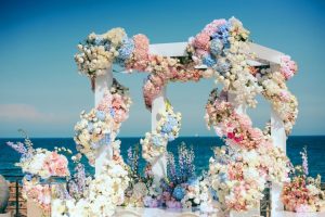 Pink-wedding-theme-–-the-main-tips-and-tricks-that-will-guide-you-to-the-perfect-event_wedding-arch-with-lots-of-flowers