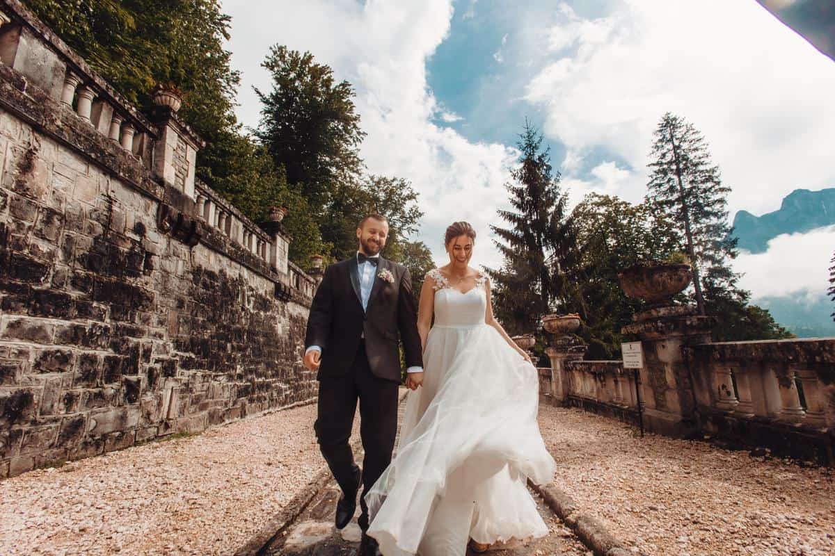 Rose gold wedding theme - bride and groom at Cantacuzino Castle