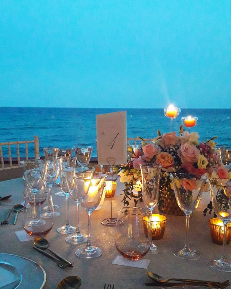 2. Champagne wedding theme ideas - wedding in Spain, candles, table, sea