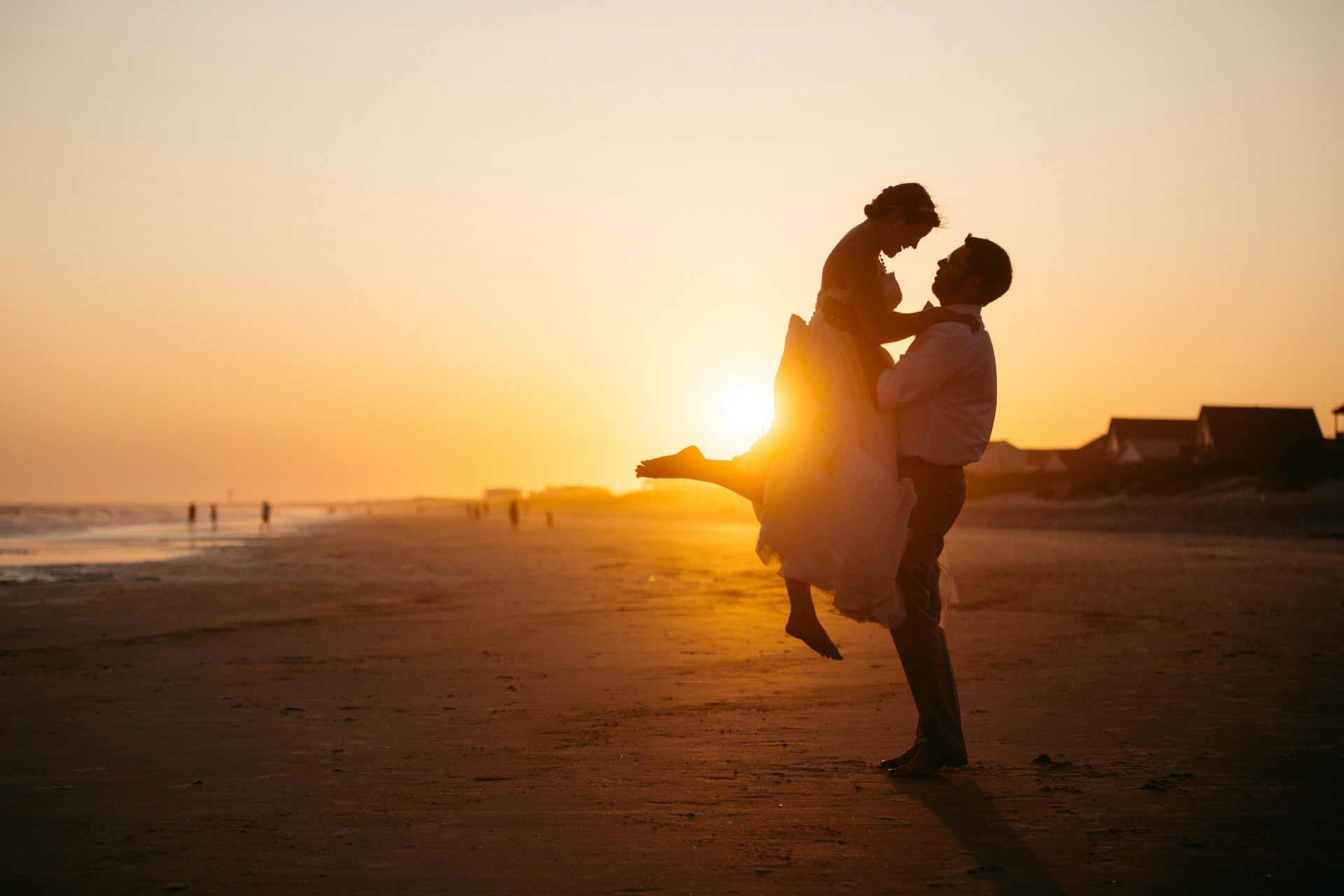 Red and gold wedding - couple, sunset, beach