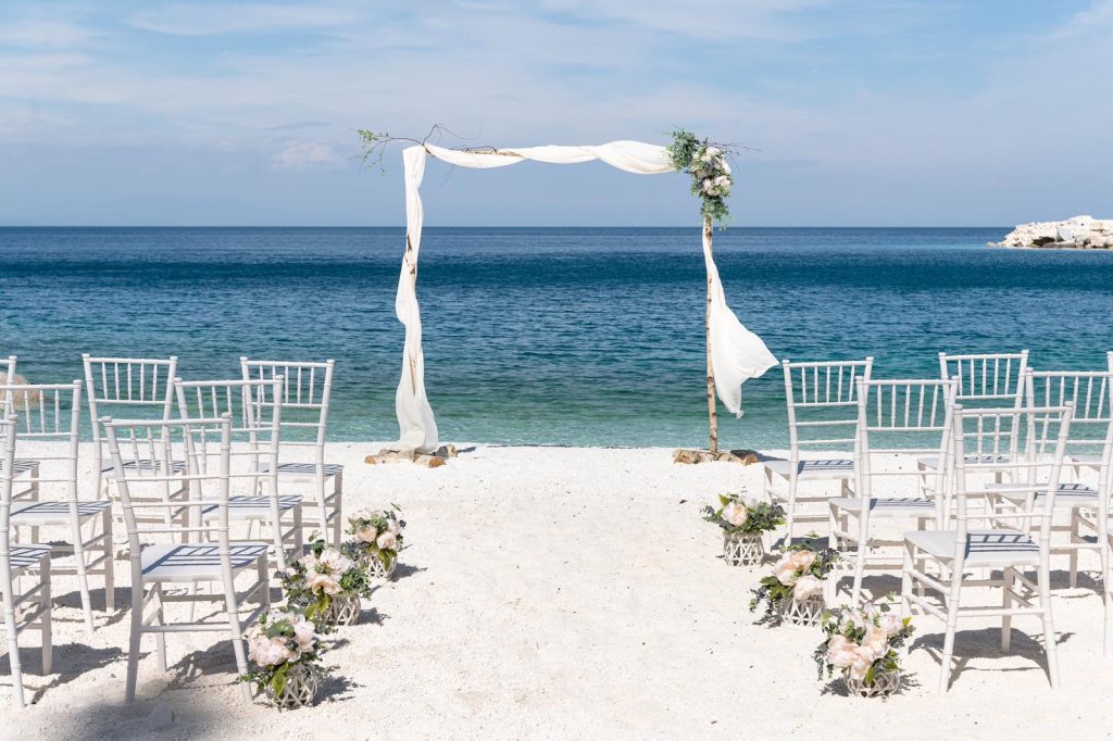 3. Peacock wedding theme decor - beach wedding, chairs