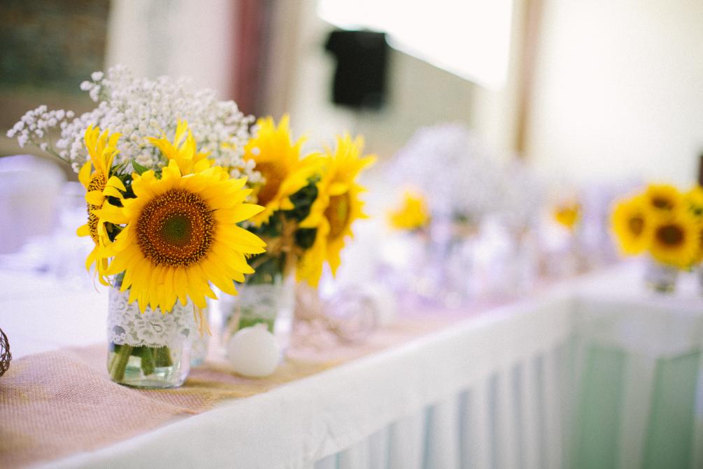 5. Wedding sunflower ideas - sunflowers, white table