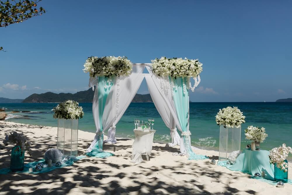 Combining emerald green with other colors for a richer wedding palette - burgundy, royal blue, pink and silver (blue and emerald hues)